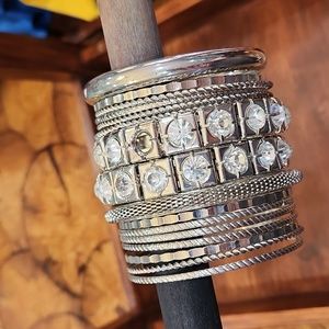 Set of 16 silver bangles, large and small, gems and plain